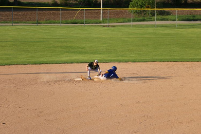 Cade Johnson sliding into 2nd base against Wittenberg-Birnamwood