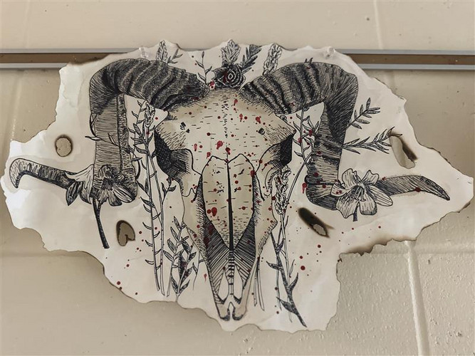 drawing of ram skull with flowers
